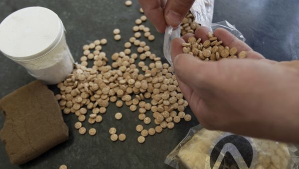 Captagon pills displayed along with a cup of cocaine and hashish (File) Captagon pills displayed along with a cup of cocaine and hashish (File) - Sputnik International