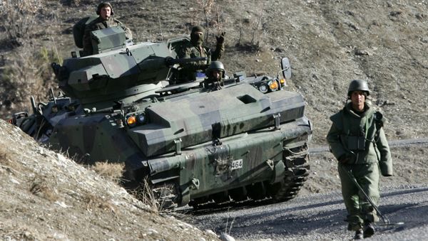 Turkish soldiers patrol on a road near the Turkey-Iraq border in the mainly Kurdish southeastern province of Sirnak (File) - Sputnik International