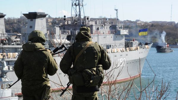 Russian forces patrol near the Ukrainian navy ship Slavutich in the harbor of the Ukrainian city of Sevastopol on March 5, 2014 - Sputnik International