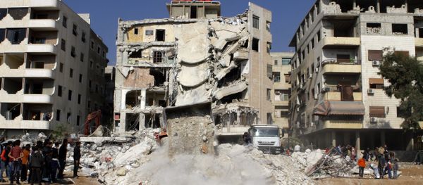 A general view taken on December 20, 2015, shows a bulldozer clearing debris from the site of a reported Israeli air raid that killed a senior figure in the Lebanese Shiite militant group Hezbollah, Samir Kantar, in Jaramana, southeast of the Syrian capital Damascus. - Sputnik International