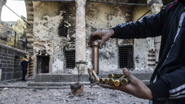 A boy shows bullets used during clashes between Kurdish fighters and Turkish special forces in the Sur district in Diyarbakir on December 11, 2015. A boy shows bullets used during clashes between Kurdish fighters and Turkish special forces in the Sur district in Diyarbakir on December 11, 2015. - Sputnik International