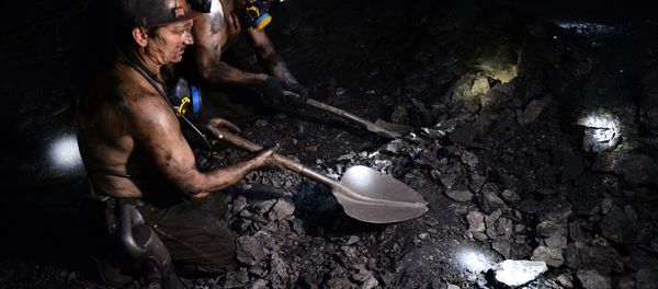 A miner works at the Kalinovskaya-Vostochnaya coal mine in the eastern Ukrainian city of Makeevka near Donetsk - Sputnik International