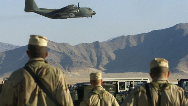 American soldiers watch a Hercules C-130 plane take off at the Bargam airbase north of Kabul American soldiers watch a Hercules C-130 plane take off at the Bargam airbase north of Kabul - Sputnik International