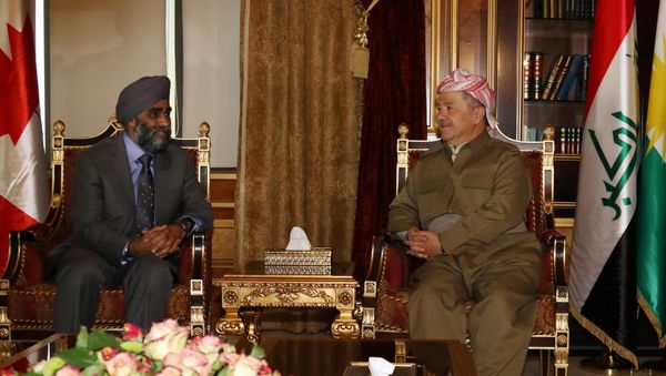 Canadian Minister of National Defence Harjit Sajjan (L) meets with Iraqi Kurdish leader Massud Barzani in Arbil, the capital of the Kurdish autonomous region in northern Iraq, on December 21, 2015. - Sputnik International