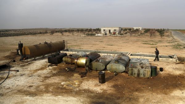 Men work at a makeshift oil refinery site in Marchmarin town, southern countryside of Idlib, Syria December 16, 2015. The refinery site, owned by Yousef Ayoub, 34, has been active for 4 months. Ayoub says that he gets the crude oil from Islamic State-controlled areas in Deir al-Zor province and Iraq. The price for a barrel of crude oil varies and is controlled by the Islamic State, but it is currently at $44 dollars per barrel, he said. Men work at a makeshift oil refinery site in Marchmarin town, southern countryside of Idlib, Syria December 16, 2015. The refinery site, owned by Yousef Ayoub, 34, has been active for 4 months. Ayoub says that he gets the crude oil from Islamic State-controlled areas in Deir al-Zor province and Iraq. The price for a barrel of crude oil varies and is controlled by the Islamic State, but it is currently at $44 dollars per barrel, he said. - Sputnik International