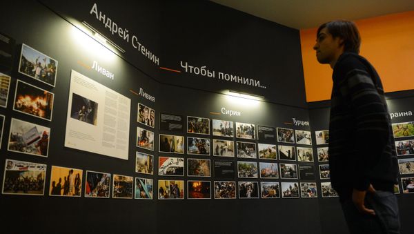 Photographic exhibition of MIA Rossiya Segodnya news agency photo correspondent Andrei Stenin killed in Ukraine on professional duty. - Sputnik International