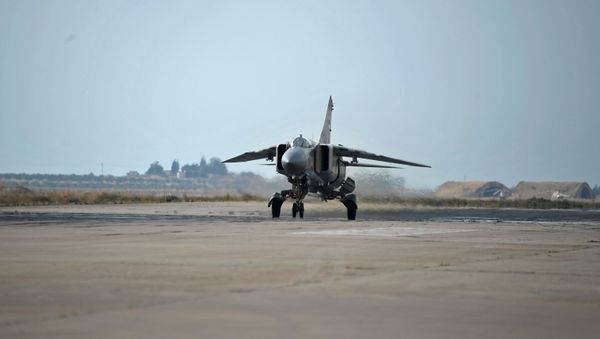 A MiG-23 aircraft of the Syrian Air Force on a runaway at the Hama airbase near the city of Hama, Syria's Hama Province - Sputnik International