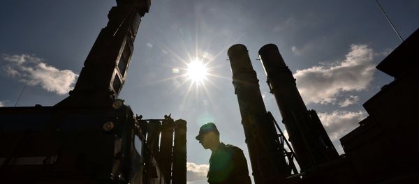 A serviceman stands near an S-300 surface-to-air missile system. (File) A serviceman stands near an S-300 surface-to-air missile system. (File) - Sputnik International