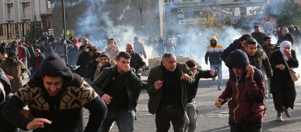 Riot police fire tear gas to disperse demonstrators during a protest against the curfew in Sur district, in the southeastern city of Diyarbakir, Turkey, December 14, 2015 Riot police fire tear gas to disperse demonstrators during a protest against the curfew in Sur district, in the southeastern city of Diyarbakir, Turkey, December 14, 2015 - Sputnik International
