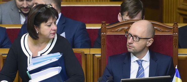 Finance Minister Natalia Yaresko (L) and Ukrainian Prime Minister Arseny Yatsenyk (R) prepare to present the draft of the new state budget during the parliament hearing in Kiev on December 17, 2015 Finance Minister Natalia Yaresko (L) and Ukrainian Prime Minister Arseny Yatsenyk (R) prepare to present the draft of the new state budget during the parliament hearing in Kiev on December 17, 2015 - Sputnik International