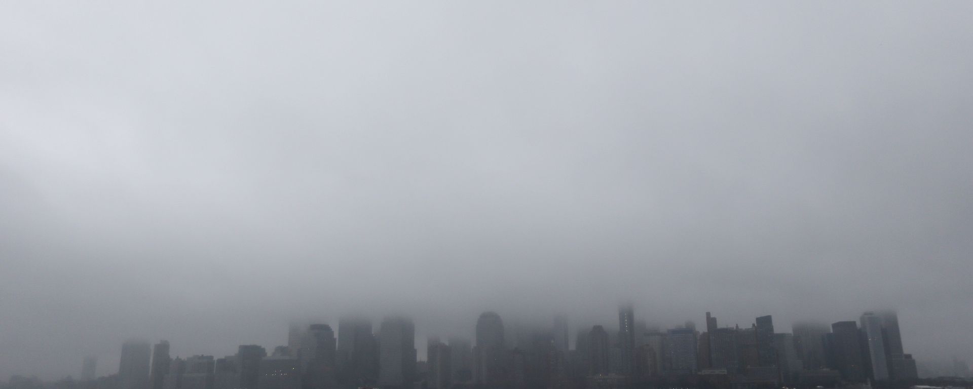 A boat chugs along the Hudson River as fog and clouds blanket over the New York City Skyline seen from Liberty State Park, Wednesday, Dec. 23, 2015, in Jersey City, N.J A boat chugs along the Hudson River as fog and clouds blanket over the New York City Skyline seen from Liberty State Park, Wednesday, Dec. 23, 2015, in Jersey City, N.J - Sputnik International, 1920, 18.10.2022