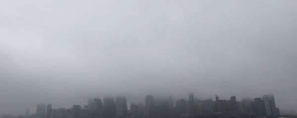 A boat chugs along the Hudson River as fog and clouds blanket over the New York City Skyline seen from Liberty State Park, Wednesday, Dec. 23, 2015, in Jersey City, N.J - Sputnik International