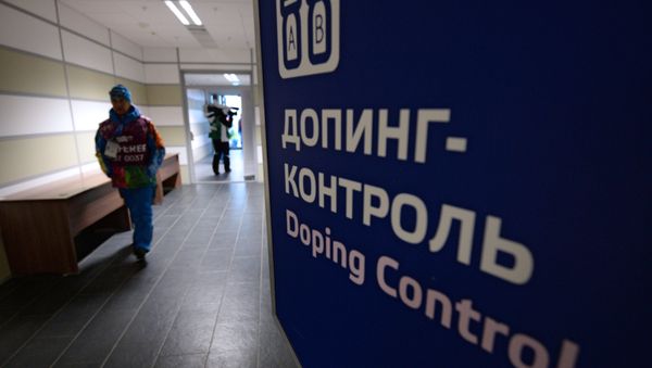 An employee of the Laura Cross-Country Ski & Biathlon Center before the men’s biathlon mass start race at the XXII Olympic Winter Games in Sochi - Sputnik International