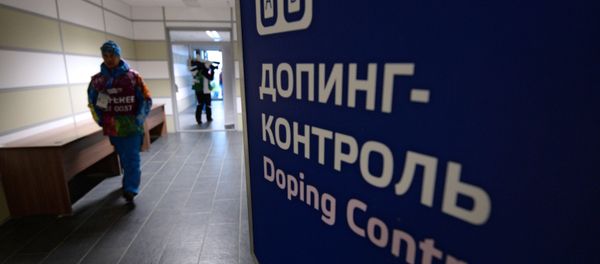 An employee of the Laura Cross-Country Ski & Biathlon Center before the men’s biathlon mass start race at the XXII Olympic Winter Games in Sochi - Sputnik International