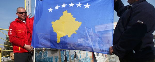 Residents of Pristina holding a new flag of the self-proclaimed republic of Kosovo Residents of Pristina holding a new flag of the self-proclaimed republic of Kosovo - Sputnik International