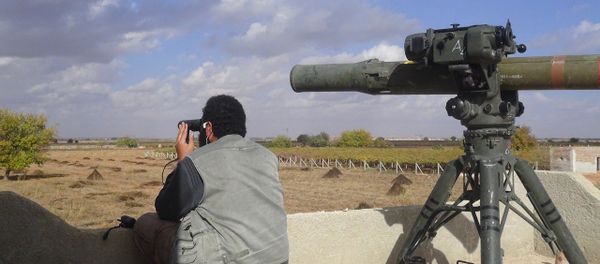 In this file photo released on Dec. 21, 2015, by the Rased News Network on a page affiliated with Islamic State militants, an Islamic State militant prepares to fire a TOW-1 anti-tank missile in Aleppo, northern Syria In this file photo released on Dec. 21, 2015, by the Rased News Network on a page affiliated with Islamic State militants, an Islamic State militant prepares to fire a TOW-1 anti-tank missile in Aleppo, northern Syria - Sputnik International