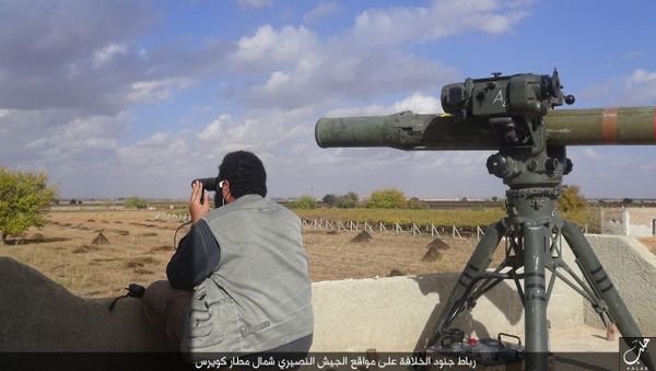 In this file photo released on Dec. 21, 2015, by the Rased News Network on a page affiliated with Islamic State militants, an Islamic State militant prepares to fire a TOW-1 anti-tank missile in Aleppo, northern Syria - Sputnik International