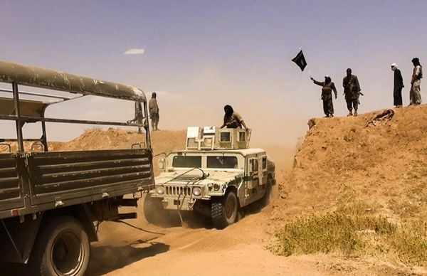 Islamic State of Iraq and the Levant (ISIL) militants waving the trademark Jihadits flag as vehicles drive on a newly cut road through the Syrian-Iraqi border between the Iraqi Nineveh province and the Syrian town of Al-Hasakah (File) Islamic State of Iraq and the Levant (ISIL) militants waving the trademark Jihadits flag as vehicles drive on a newly cut road through the Syrian-Iraqi border between the Iraqi Nineveh province and the Syrian town of Al-Hasakah (File) - Sputnik International