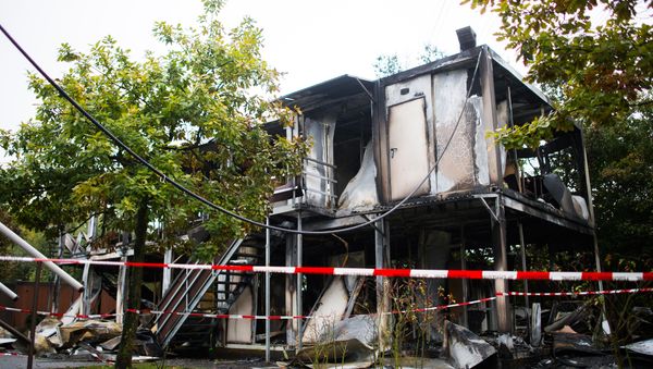 Burned out mobile homes are seen at a refugee shelter on October 18, 2015 in Hamburg, northern Germany (File) Burned out mobile homes are seen at a refugee shelter on October 18, 2015 in Hamburg, northern Germany (File) - Sputnik International