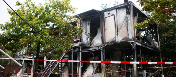 Burned out mobile homes are seen at a refugee shelter on October 18, 2015 in Hamburg, northern Germany (File) Burned out mobile homes are seen at a refugee shelter on October 18, 2015 in Hamburg, northern Germany (File) - Sputnik International