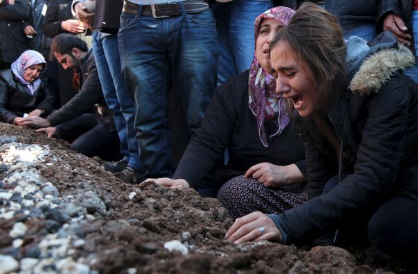 Relatives of Siyar Salman mourn over his grave during a funeral ceremony in the Kurdish dominated southeastern city of Diyarbakir, Turkey, December 15, 2015. According to local media, Salman, a 19-year old man, was killed on Monday in Diyarbakir during a protest against the curfew in Sur district. Relatives of Siyar Salman mourn over his grave during a funeral ceremony in the Kurdish dominated southeastern city of Diyarbakir, Turkey, December 15, 2015. According to local media, Salman, a 19-year old man, was killed on Monday in Diyarbakir during a protest against the curfew in Sur district. - Sputnik International