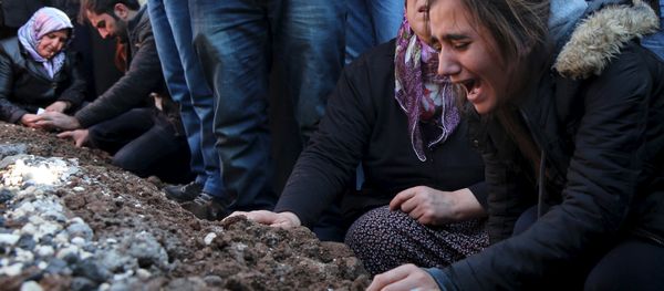 Relatives of Siyar Salman mourn over his grave during a funeral ceremony in the Kurdish dominated southeastern city of Diyarbakir, Turkey, December 15, 2015. According to local media, Salman, a 19-year old man, was killed on Monday in Diyarbakir during a protest against the curfew in Sur district. Relatives of Siyar Salman mourn over his grave during a funeral ceremony in the Kurdish dominated southeastern city of Diyarbakir, Turkey, December 15, 2015. According to local media, Salman, a 19-year old man, was killed on Monday in Diyarbakir during a protest against the curfew in Sur district. - Sputnik International