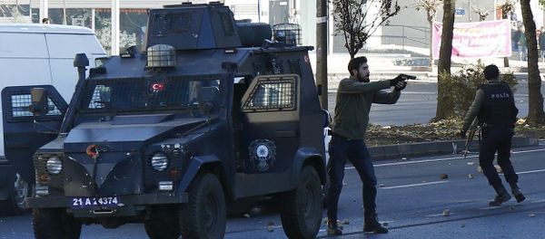 Plainclothes policemen react during a protest following a funeral ceremony for Kurdish militants in the southeastern city of Diyarbakir, Turkey, December 24, 2015. Plainclothes policemen react during a protest following a funeral ceremony for Kurdish militants in the southeastern city of Diyarbakir, Turkey, December 24, 2015. - Sputnik International
