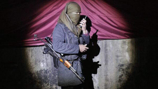 A militant of the Kurdistan Workers' Party, or PKK, stands at a barricade in Sirnak, Turkey, late Wednesday, Dec. 23, 2015. A militant of the Kurdistan Workers' Party, or PKK, stands at a barricade in Sirnak, Turkey, late Wednesday, Dec. 23, 2015. - Sputnik International