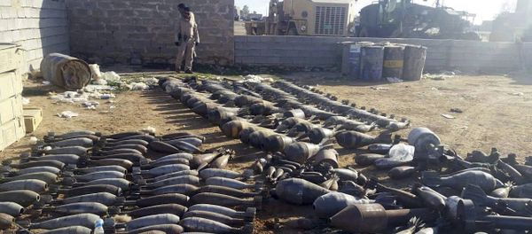 Weapons and explosives confiscated by Iraqi security forces from Islamic State militants are on display at an Iraqi army base as security forces advance their position in northern Ramadi, 70 miles (115 kilometers) west of Baghdad, Iraq - Sputnik International