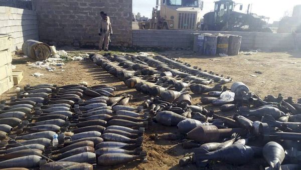 Weapons and explosives confiscated by Iraqi security forces from Islamic State militants are on display at an Iraqi army base as security forces advance their position in northern Ramadi, 70 miles (115 kilometers) west of Baghdad, Iraq - Sputnik International