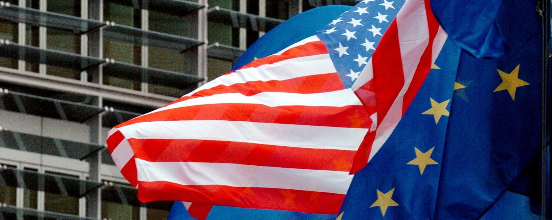 US and European flags float in front of the European Commission headquarters in Brussels 22 February 2005 US and European flags float in front of the European Commission headquarters in Brussels 22 February 2005 - Sputnik International, 1920, 18.01.2024