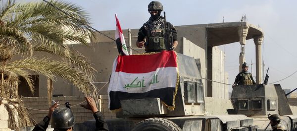 Iraqi security forces surround the government complex in central Ramadi, 70 miles (115 kilometers) west of Baghdad, Iraq, Monday, Dec. 28, 2015. Iraqi security forces surround the government complex in central Ramadi, 70 miles (115 kilometers) west of Baghdad, Iraq, Monday, Dec. 28, 2015. - Sputnik International