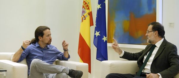Spain's Prime Minister Mariano Rajoy, right, talks to Podemos party leader Pablo Iglesias during their meeting at the Moncloa palace, the Spanish premier's official residence, in Madrid. Spain's Prime Minister Mariano Rajoy, right, talks to Podemos party leader Pablo Iglesias during their meeting at the Moncloa palace, the Spanish premier's official residence, in Madrid. - Sputnik International