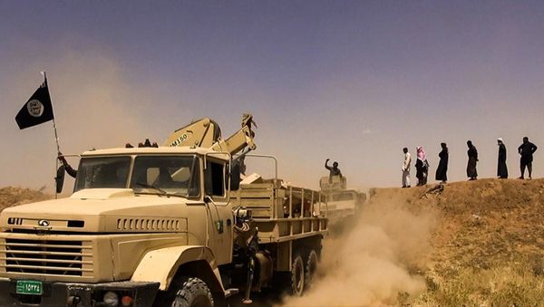 Daesh (ISIL) militants waving the trademark Jihadits flag as vehicles drive on a newly cut road through the Syrian-Iraqi border between the Iraqi Nineveh province and the Syrian town of Al-Hasakah - Sputnik International