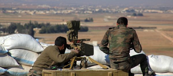 Syrian pro-government fighters guard a post in the Tal Sharba area on the outskirts of the northern Syrian city of Aleppo on December 27, 2015 after they seized the area from Islamic State (IS) group jihadists - Sputnik International