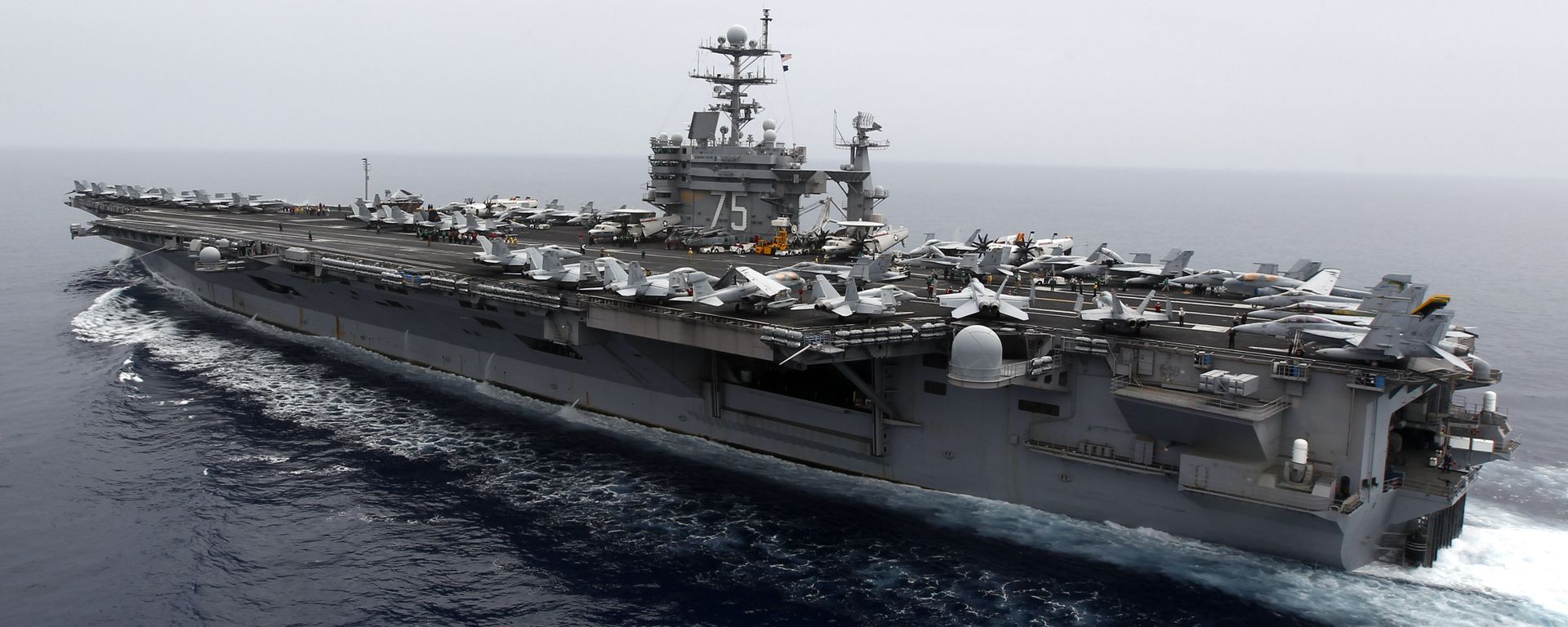 A general view shows the nuclear-powered aircraft carrier USS Harry S. Truman at an undisclosed position in the Mediterranean Sea, south of Sicily, Monday June 14, 2010 A general view shows the nuclear-powered aircraft carrier USS Harry S. Truman at an undisclosed position in the Mediterranean Sea, south of Sicily, Monday June 14, 2010 - Sputnik International, 1920, 22.03.2022