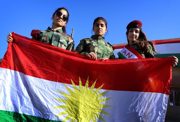 Iraqi Kurdish girls carry a Kurdistan flag during the celebration of Flag Day in the northern city of Arbil, the capital of the autonomous Kurdish region in northern Iraq - Sputnik International