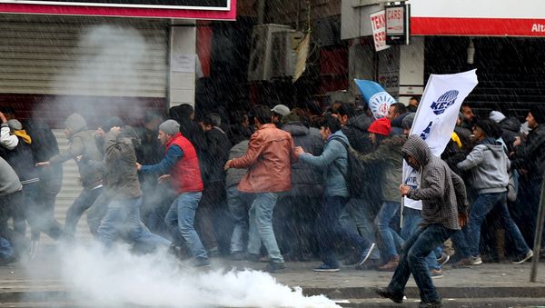 Turkish riot police use water cannons and tear gas to disperse Kurdish demonstrators during a protest against the curfew in Sur district and security operations, in the southeastern city of Diyarbakir, Turkey Turkish riot police use water cannons and tear gas to disperse Kurdish demonstrators during a protest against the curfew in Sur district and security operations, in the southeastern city of Diyarbakir, Turkey - Sputnik International