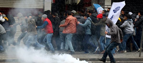 Turkish riot police use water cannons and tear gas to disperse Kurdish demonstrators during a protest against the curfew in Sur district and security operations, in the southeastern city of Diyarbakir, Turkey - Sputnik International