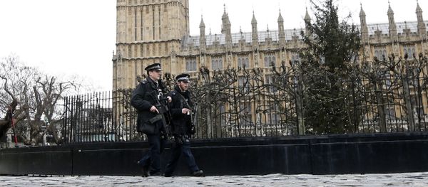Armed police are seen on patrol at The Houses of Parliament in London, England - Sputnik International