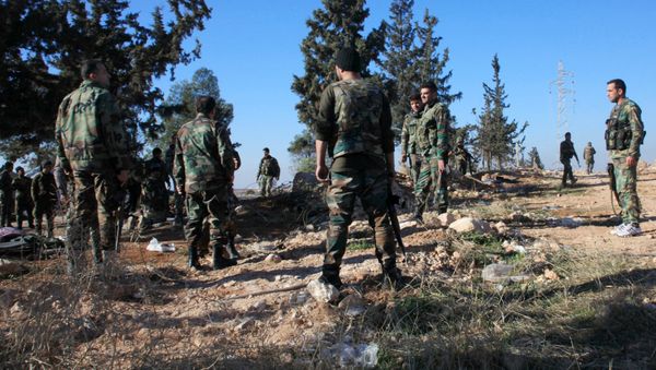 Syrian government forces inspect an area near the village of Khan Tuman, south from the provincial capital Aleppo, on December 22, 2015 Syrian government forces inspect an area near the village of Khan Tuman, south from the provincial capital Aleppo, on December 22, 2015 - Sputnik International