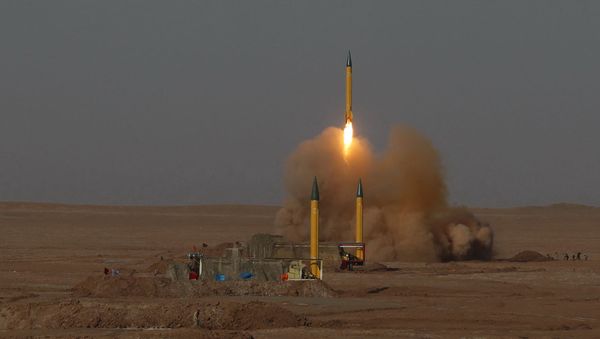 In this picture released by the Iranian Fars News Agency, asurface-to-surface missile is launched during the Iranian Revolutionary Guards maneuver in an undisclosed location in Iran, Tuesday, July 3, 2012 In this picture released by the Iranian Fars News Agency, asurface-to-surface missile is launched during the Iranian Revolutionary Guards maneuver in an undisclosed location in Iran, Tuesday, July 3, 2012 - Sputnik International