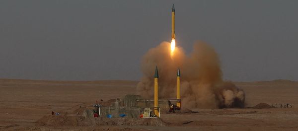 In this picture released by the Iranian Fars News Agency, asurface-to-surface missile is launched during the Iranian Revolutionary Guards maneuver in an undisclosed location in Iran, Tuesday, July 3, 2012 - Sputnik International
