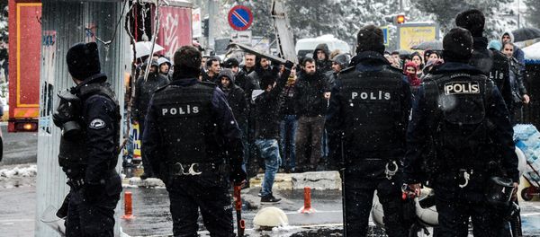 Turkish riot police officers block the crowd as they shout slogans on December 31, 2015 in Diyarbakir, during a demonstration after a curfew was lifted from the city Turkish riot police officers block the crowd as they shout slogans on December 31, 2015 in Diyarbakir, during a demonstration after a curfew was lifted from the city - Sputnik International