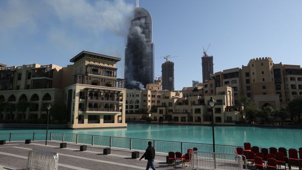 Smoke billows from the Address Downtown skyscraper in Dubai, United Arab Emirates on Friday, Jan. 1, 2016 Smoke billows from the Address Downtown skyscraper in Dubai, United Arab Emirates on Friday, Jan. 1, 2016 - Sputnik International