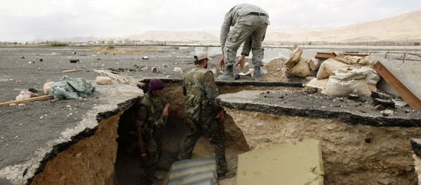 Syrian government forces get out of a tunnel, reportedly previously used by rebel fighters after they took control of Adra al-Balad city on the outskirts of the capital Damascus. File photo. - Sputnik International