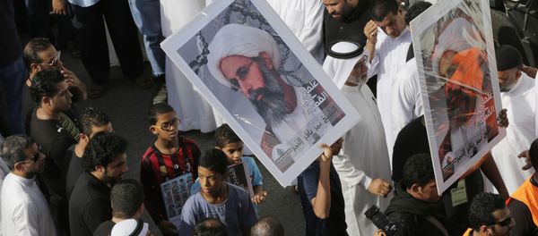 In this Saturday, May 30, 2015, photo, Saudis carry a poster demanding freedom for jailed Shiite cleric Sheikh Nimr al-Nimr, during a funeral procession, in Tarut, Saudi Arabia - Sputnik International