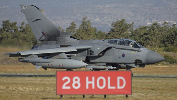 British tornado warplane passes on the runway at the RAF Akrotiri, a British air base near costal city of Limassol, Cyprus, Thursday, Dec. 3, 2015 after an airstrike. British warplanes carried out airstrikes in Syria early Thursday, hours after Parliament voted to authorize air attacks against Islamic State group targets there - Sputnik International