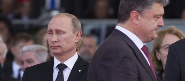 June 6, 2014. President Vladimir Putin (left) and Ukrainian President-Elect Petro Poroshenko during the celebrations of the 70th anniversary of the allied landing in Normandy - Sputnik International