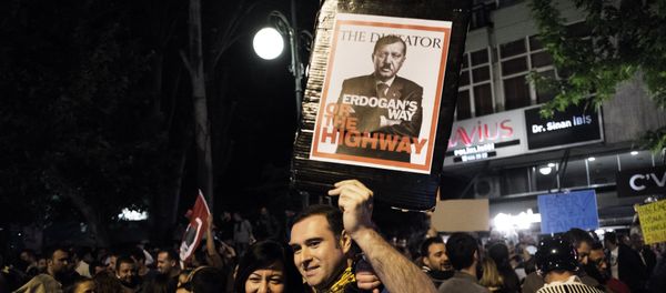A mock magazine cover displaying Turkish Prime Minister Recep Tayyip Erdogan as Adolf Hitler is shown as thousands gather in central Ankara on June 6, 2013 for a demonstration against the Islamic-rooted government of Erdogan A mock magazine cover displaying Turkish Prime Minister Recep Tayyip Erdogan as Adolf Hitler is shown as thousands gather in central Ankara on June 6, 2013 for a demonstration against the Islamic-rooted government of Erdogan - Sputnik International